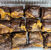 Our Chocolate Peanut Brownie is our signature brownie filled with Reese cups and topped with peanut butter. This Chocolate Peanut Butter Brownie is Heaven sent.